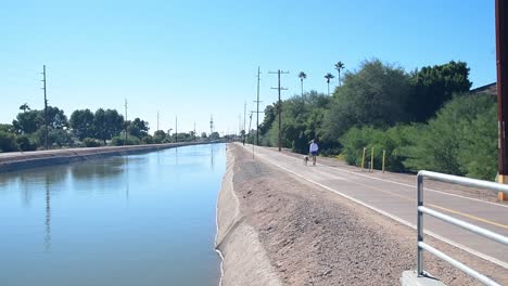 walking the dog along the scottsdale arizona trail canal.