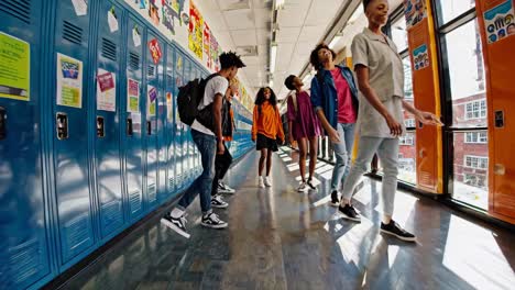 happy students in school hallway