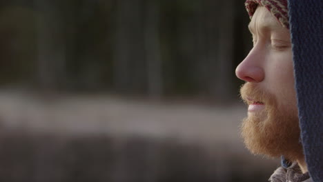 focus pull cu of a handsome bearded ice bather doing conscious breathing