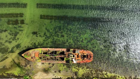 ireland Epic locations drone looking down on rusting hulk beached for good at Saltmills Wexford ireland epic drone shot