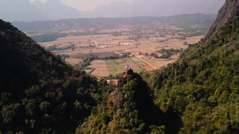 aerial view of mountain valley with temple