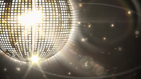 animación de una bola de espejo de discoteca girando sobre un fondo negro
