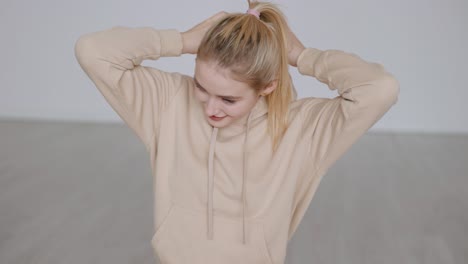 woman wearing a beige hoodie