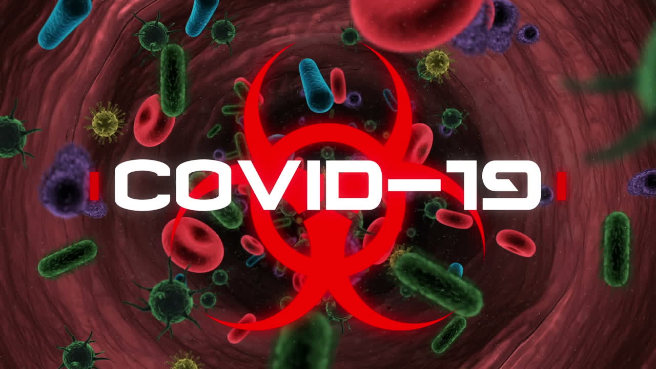 Red biological hazard icon with white word COVID-19 flashing
