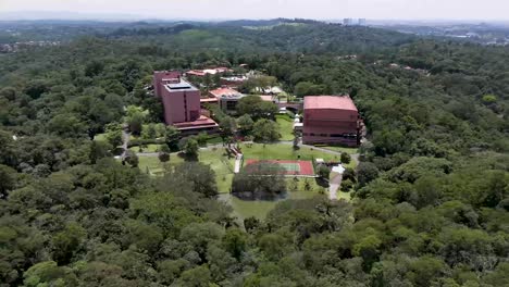 aerial view of a luxury resort in embu das artes, são paulo, surrounded by greenery and scenic hills