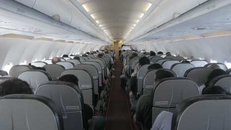 pov to the aisle pathway inside plane cabin