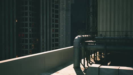 industrial rooftop view showcasing urban skyline with pipes at dusk