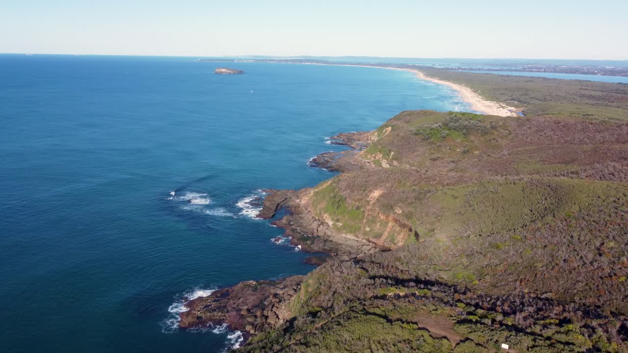 Drone aerial shot of bushland scenic landscape scenery Birdie Beach Central Coast Pacific Ocean headland nature travel tourism NSW Australia 4K