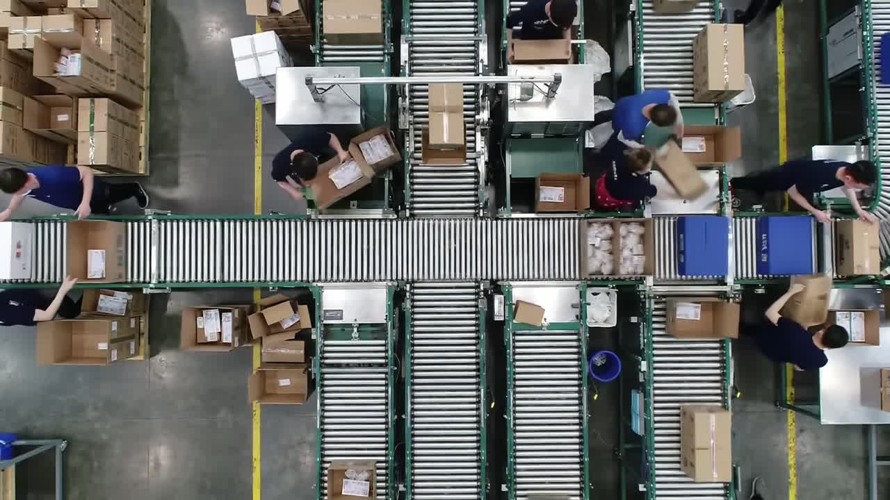 High-Volume Warehouse Operations: Efficient Sorting and Packing of Packages on Conveyor System with Diverse Workforce in Action
