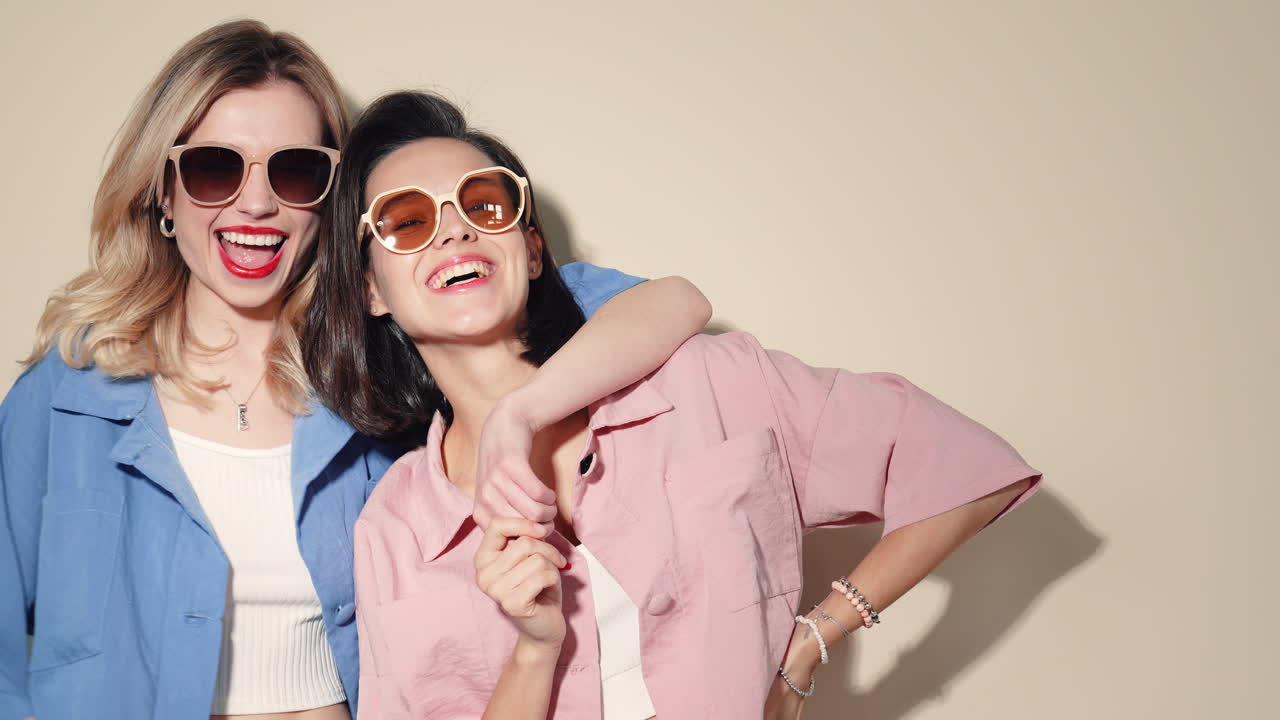 Two Women Friends Posing in Trendy Outfits