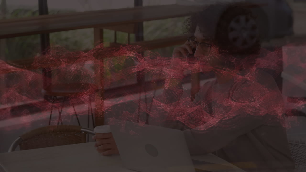 Animation of red waves over businessman in office