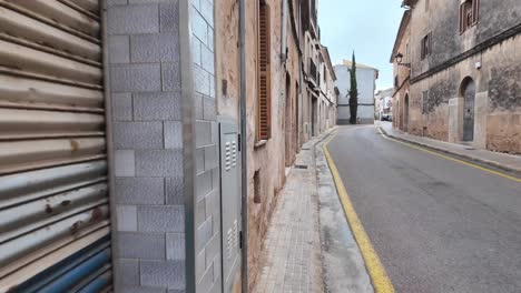 Walking-the-street-in-Algaida,-Mallorca,-Spain