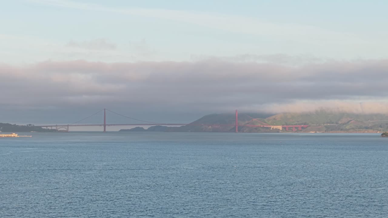 An aerial drone view of the historic Golden Gate Bridge from Treasure Island.