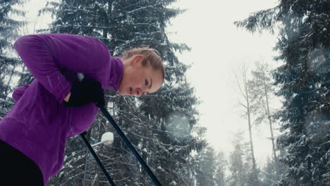 TILT-UP-Attractive-Caucasian-female-skier-catching-breath-after-ski-training.-4K-UHD-60-FPS-SLO-MO