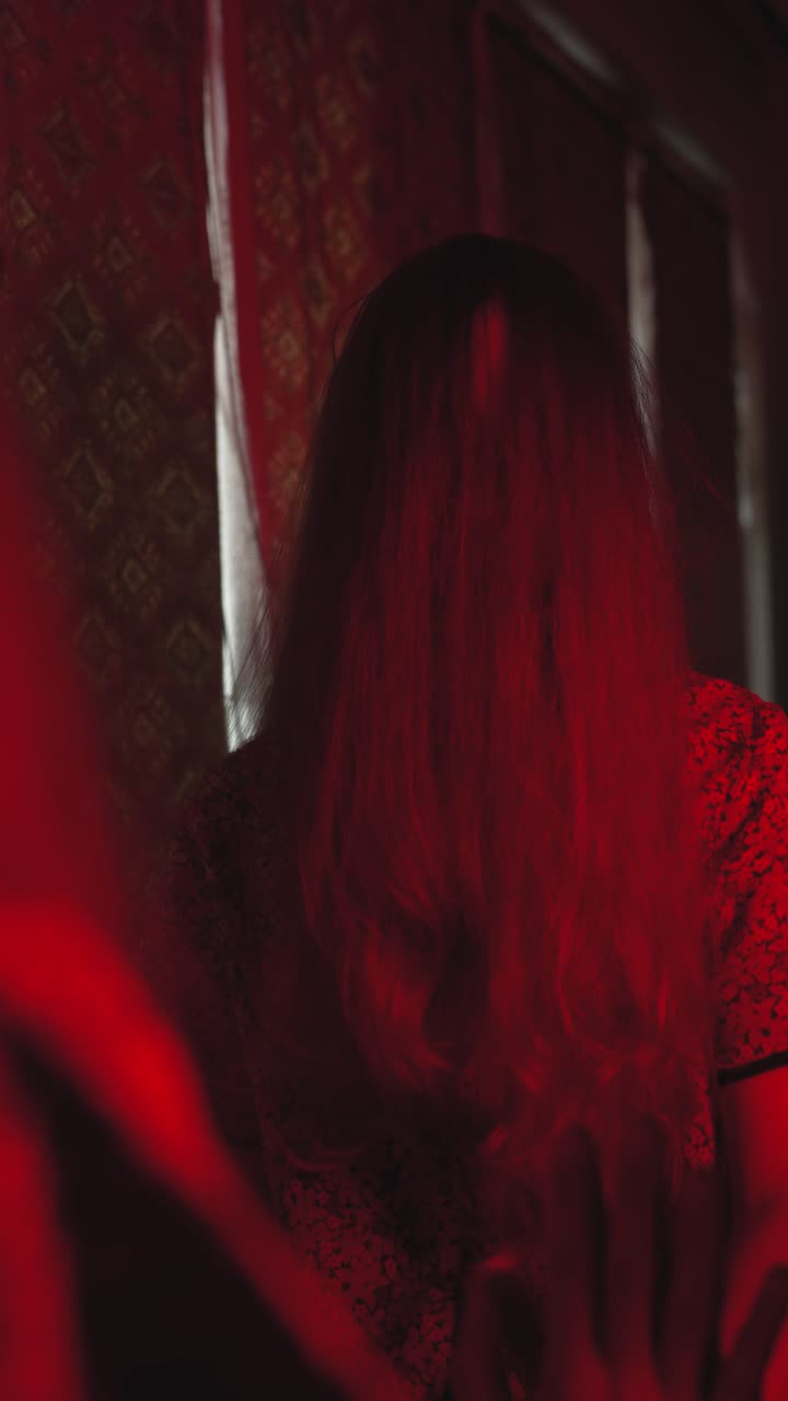 Chilling vertical frame of a woman trapped in her mind inside a decaying, dimly lit room. Ideal for eerie storytelling, horror intros, or psychological thriller projects