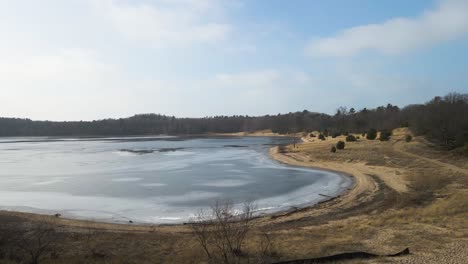 ice melting at dune harbor park in january