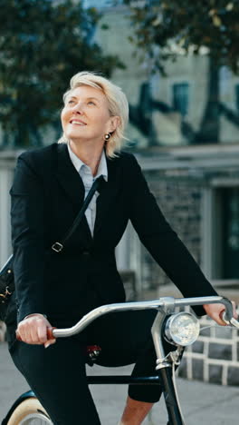 businesswoman riding bike in the city