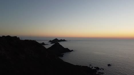 watch tower and lighthouse in corsica during sunset