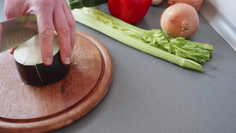 slow motion of slicing an aubergine