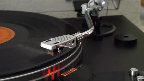 a record player spinning as the needle drops slowly onto the vinyl and the music starts