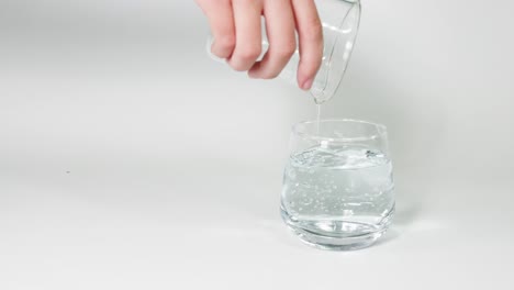 sequential pouring of water from one glass to another