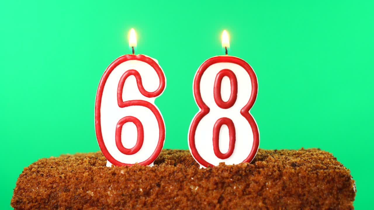 Cake with the number 68 lighted candle. Chroma key. Green Screen. Isolated