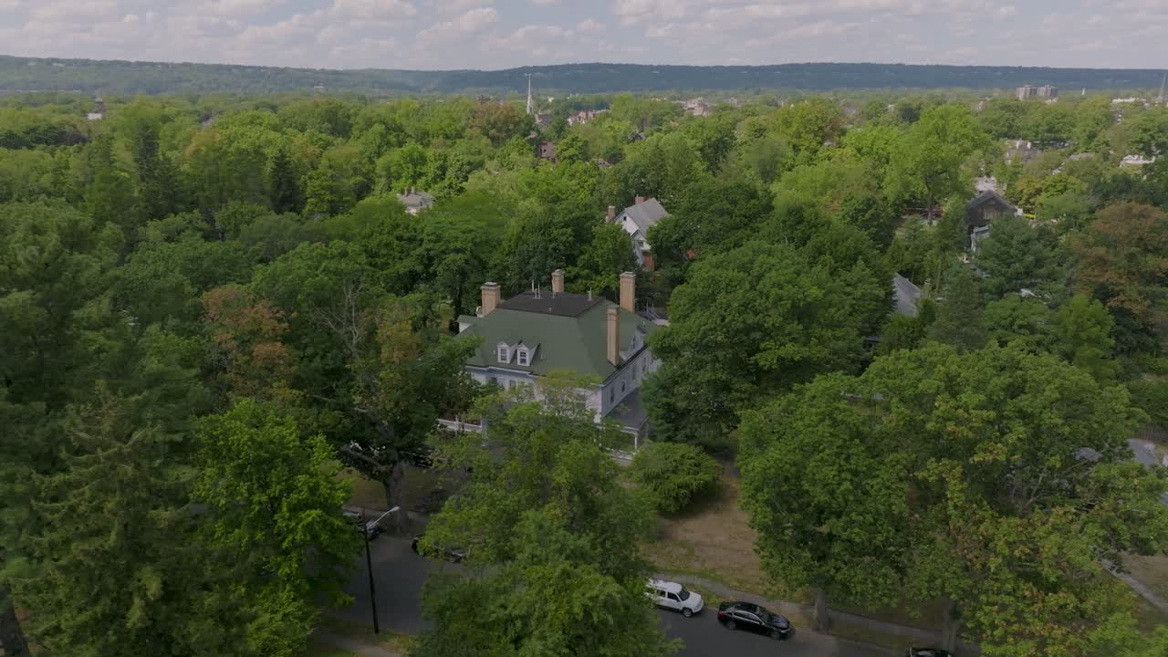 Drone footage orbiting around an old house