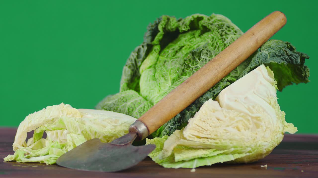 Fresh Cabbage with vegetable cutter rotates slowly.