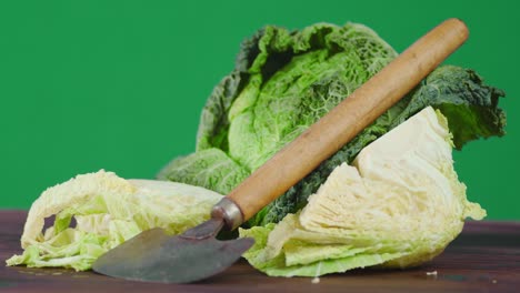 fresh cabbage with vegetable cutter rotates slowly.