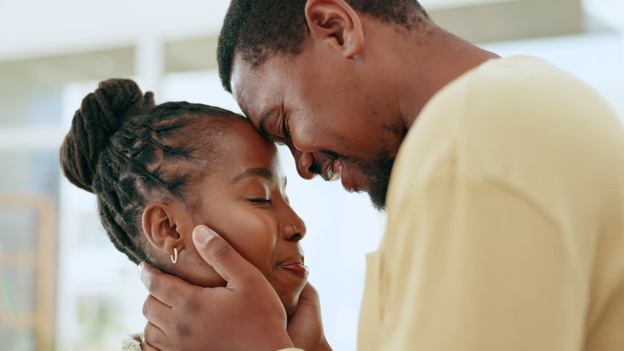 Love, kiss and happy with black couple in living