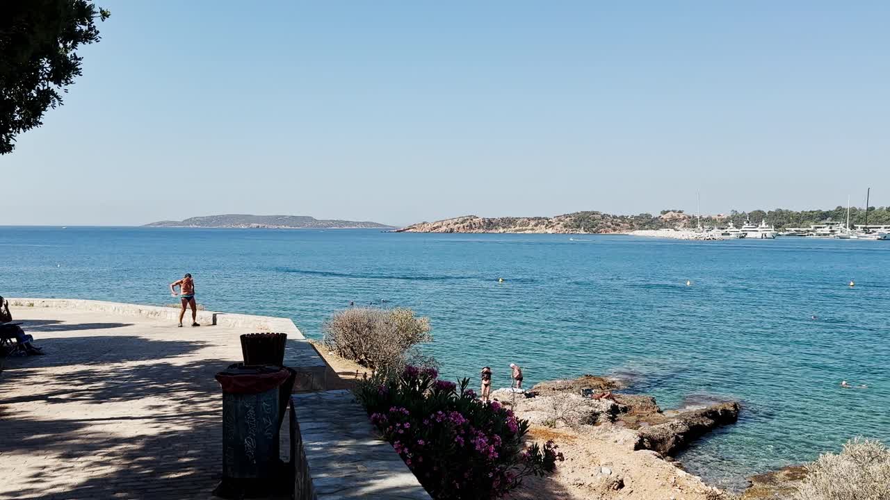 Serene Coastal Pathway Overlooking Turquoise Sea and Distant Islands