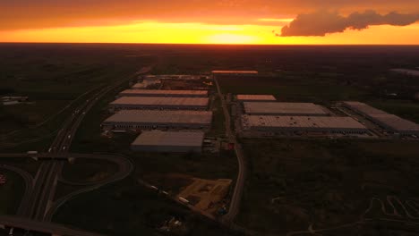 Semi-trailers-trucks-are-waiting-for-the-loading-and-unloading-of-goods-at-the-warehouse-ramps-in-a-large-logistics-park-with-a-loading-hub