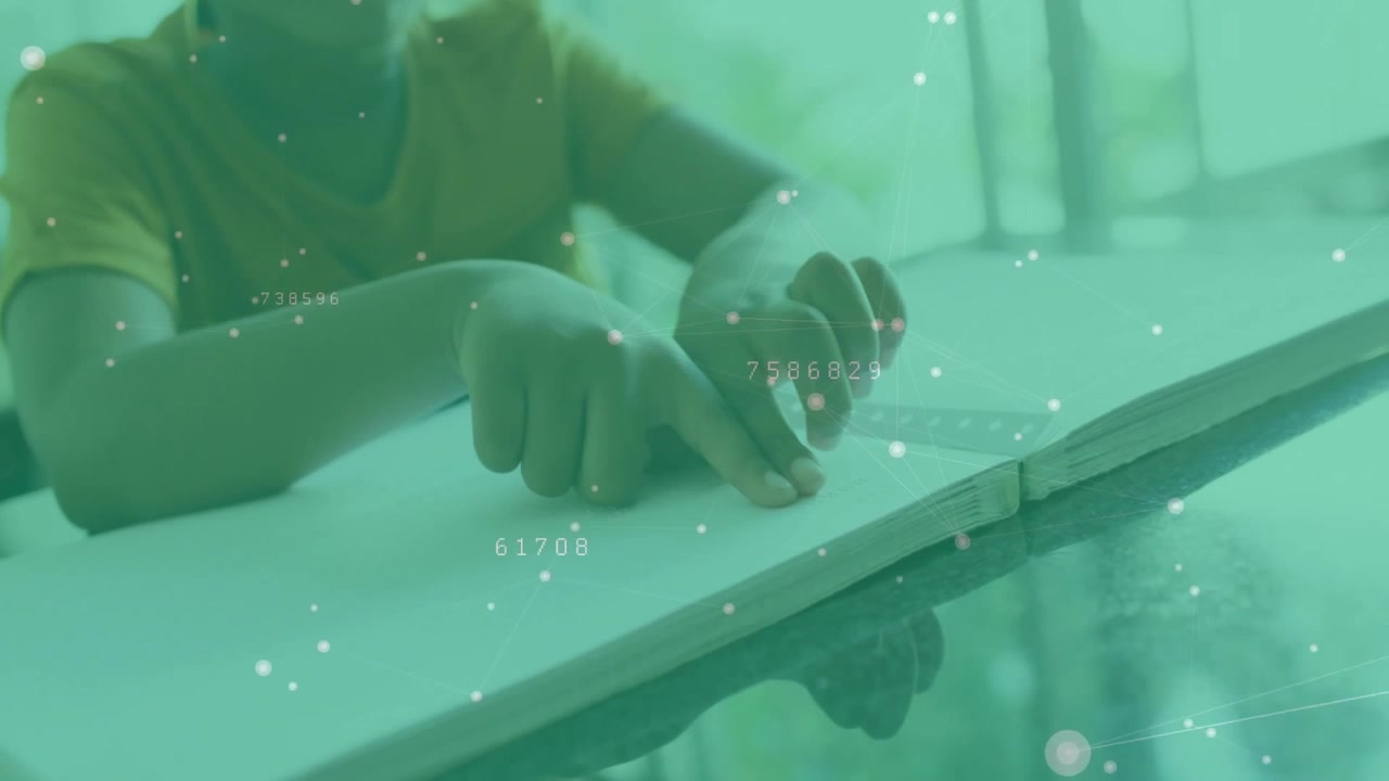 Boy placing finger on tabletop, swiping and exploring educational data overlay in study area