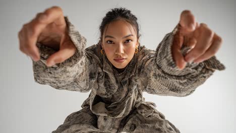 fashion model posing in slow motion on white background