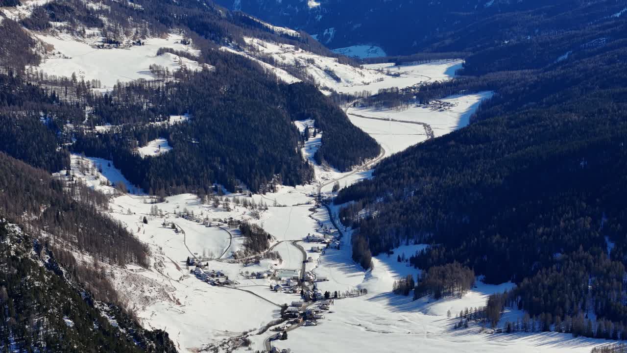 Reveal shot of landscape in the Alps during the winter (drone footage)