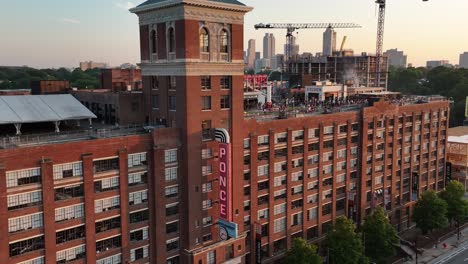 panoramic aerial view of ponce city market building exterior with rooftop amusement park and people, atlanta, georgia, usa