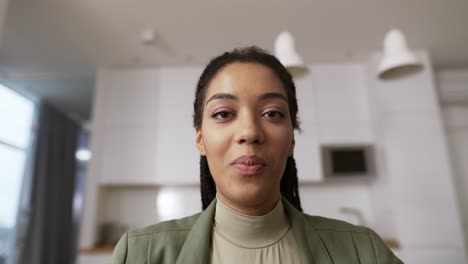Screen-headshot-of-smiling-African-American-woman-wave-greet-talk-speak-on-video-call
