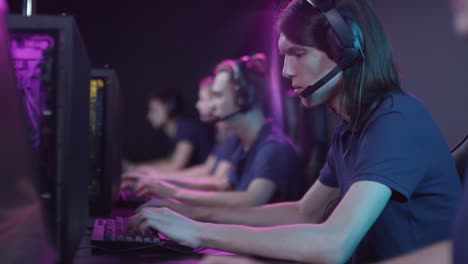 Modern-Team-Of-E-Sport-Gamers-Taking-Part-In-Online-Cybersport-Competition,-Successfully-Winning-It-And-Doing-High-Five