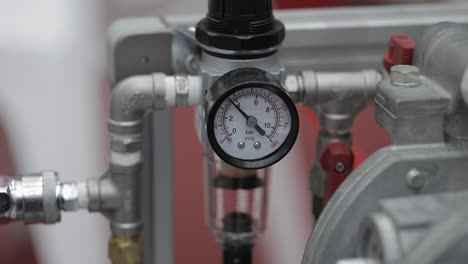 close-up of a pressure gauge and pipes