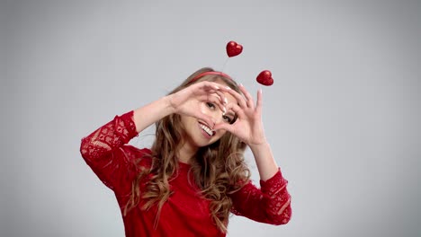 woman's hands showing sign of love