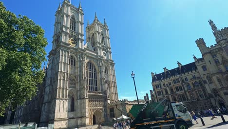 garbage truck moves past historic london landmark