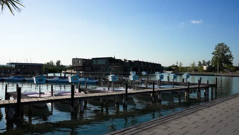 pier with boats in lake neusiedler see, neusiedl am see, austria, wide shot