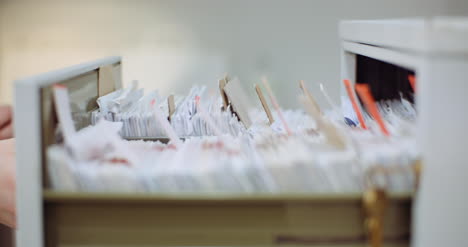 female doctor looks for personal data in the file 7