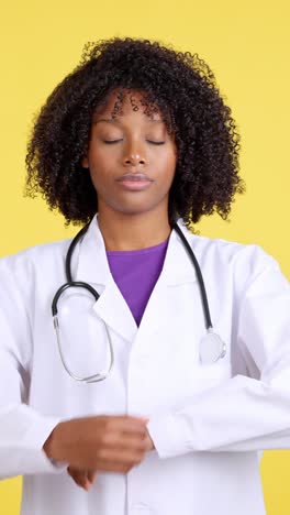 a young black female doctor with various serious and thoughtful expressions