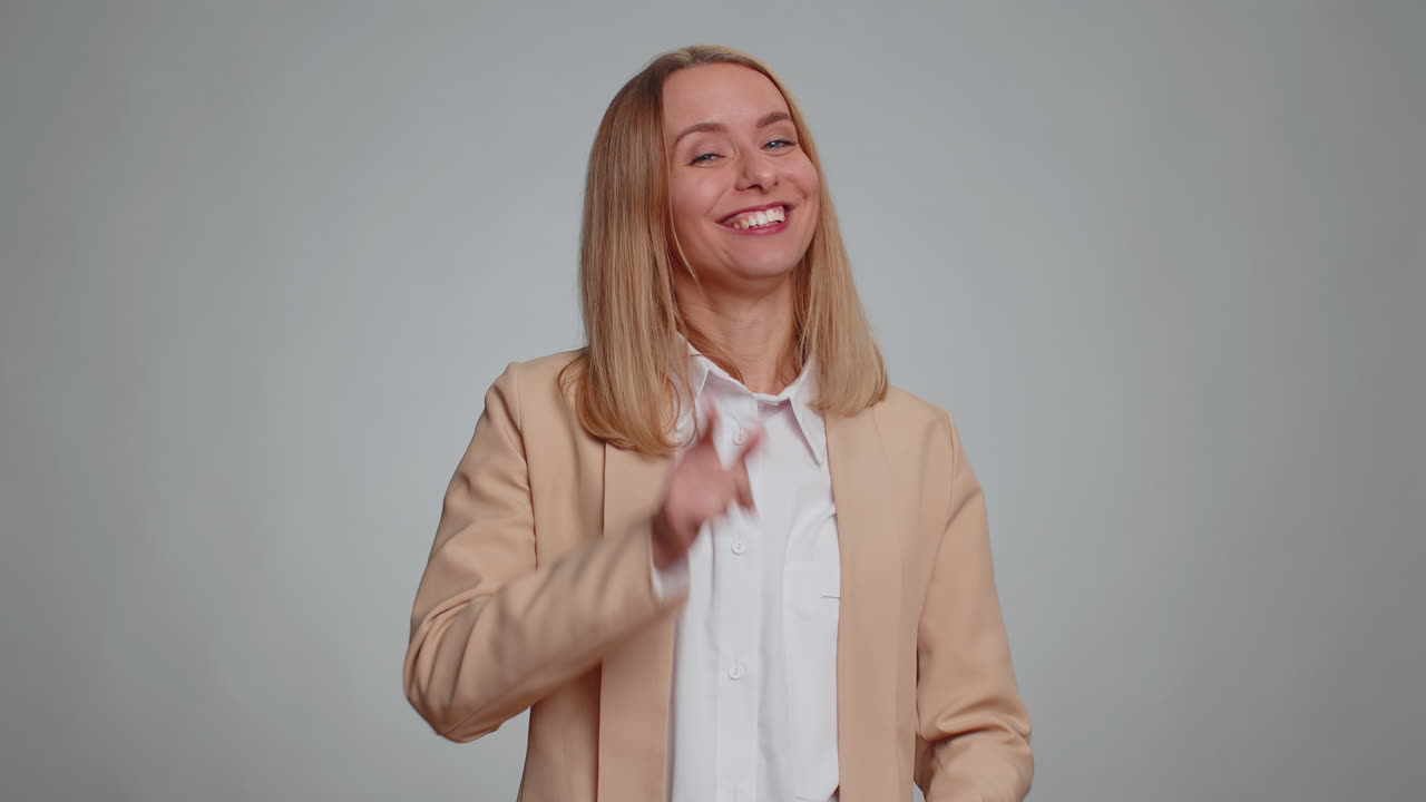 Business woman showing thumbs up and nodding in approval successful good work job celebrate win