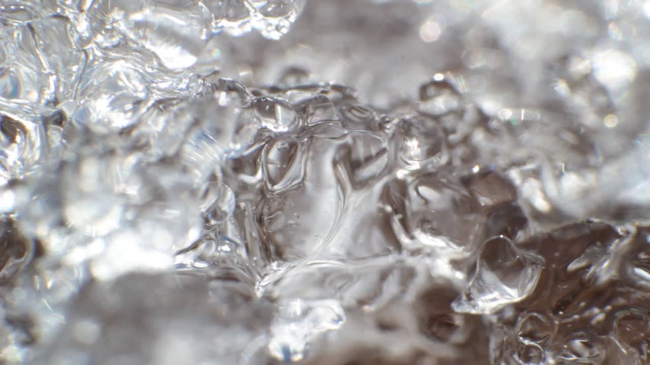 Translucent white clear ice surface melting slow with soft focus
