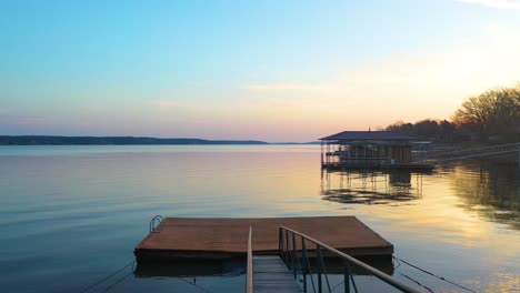 empty boat dock on the lake for waterfront home in midwest oklahoma with beautiful sunrise in background