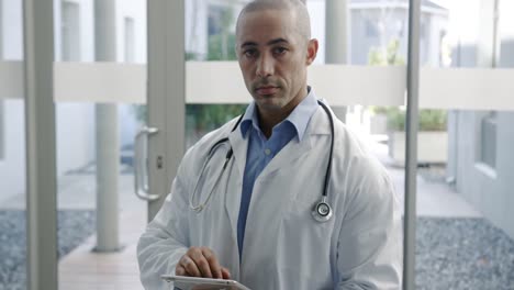 young male doctor using tablet 4k