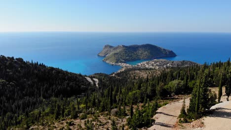 green forest landscape in an island near the asos village in kefalonia - aerial shot