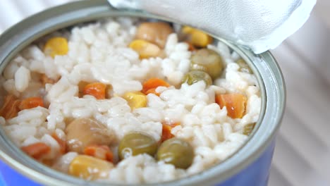 open can of rice with vegetables